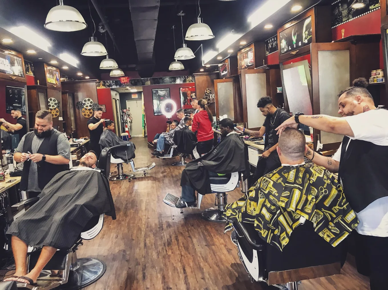 Reel Clips Barbershop - Full Interior View with Multiple Barbers Working