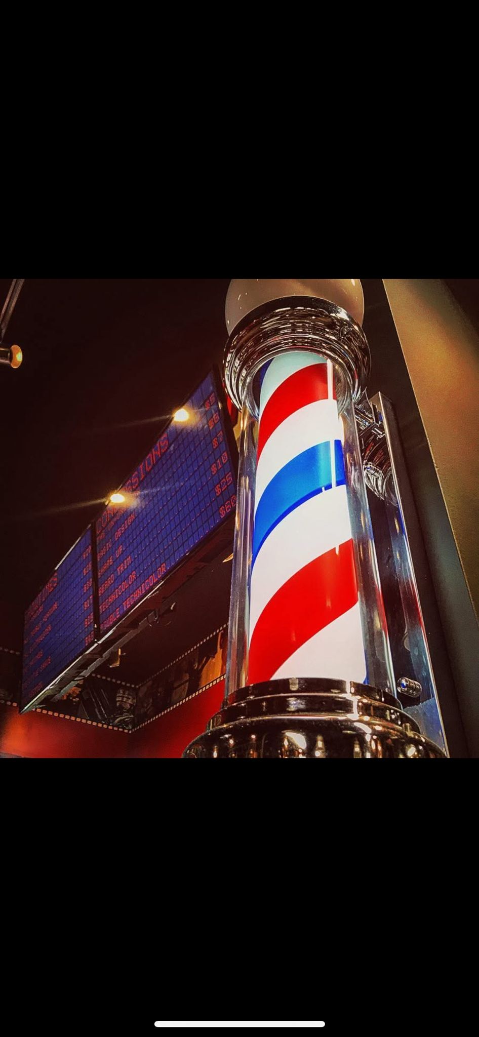 Classic barber pole with cinema elements at Reel Clips